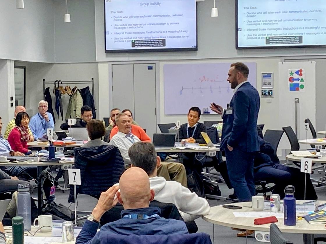 Andrew running a workshop for a full room of participants